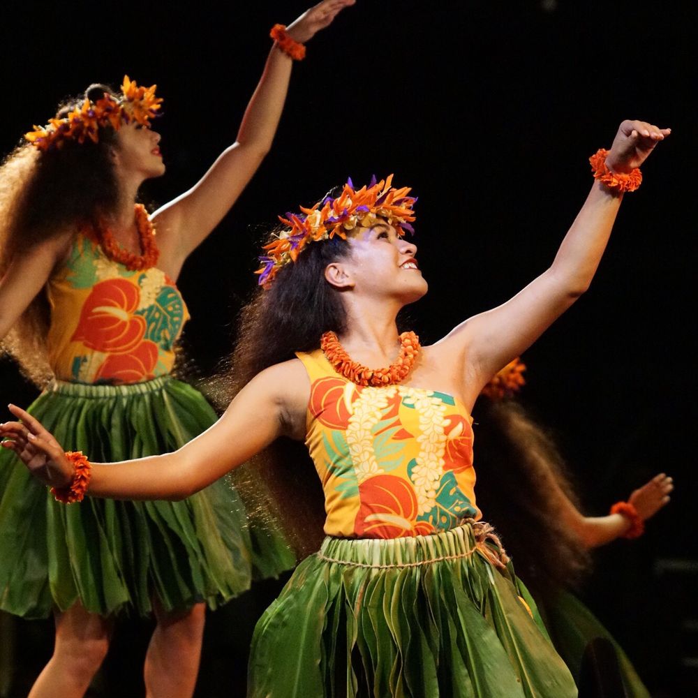 Hula dancers performing at a Hawaii performing arts event showcasing traditional Hawaiian cultural expression